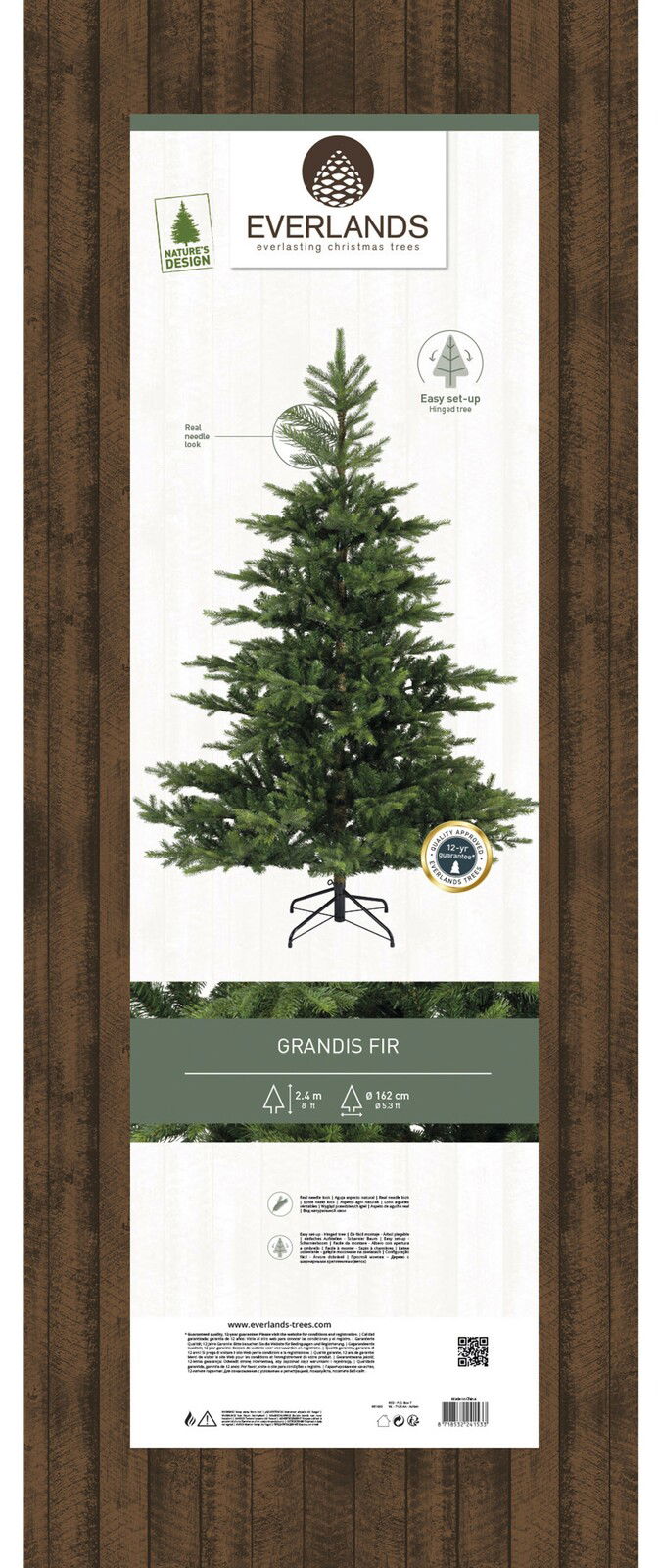 Künstlicher Weihnachtsbaum Grandis Fir, 2,4 m hoch, 1,62 m Durchmesser, mit realistischem Nadel-Look, auf einem stabilen Ständer, Frontalansicht.