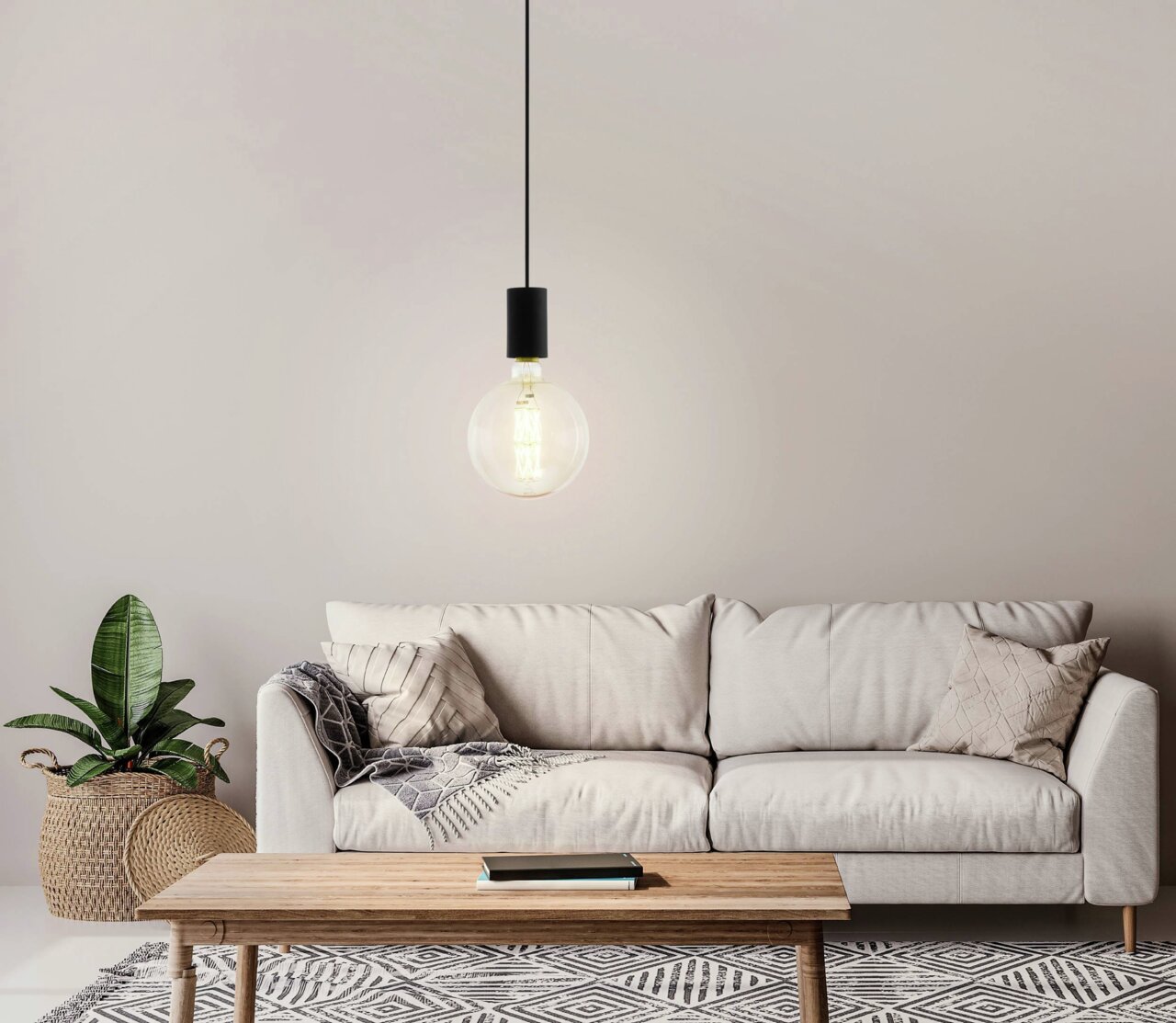 Moderne Pendelleuchte POZUETA mit großer Glühbirne, hängend über einem gemütlichen Wohnzimmer mit Sofa und Holztisch, aus frontaler Perspektive.