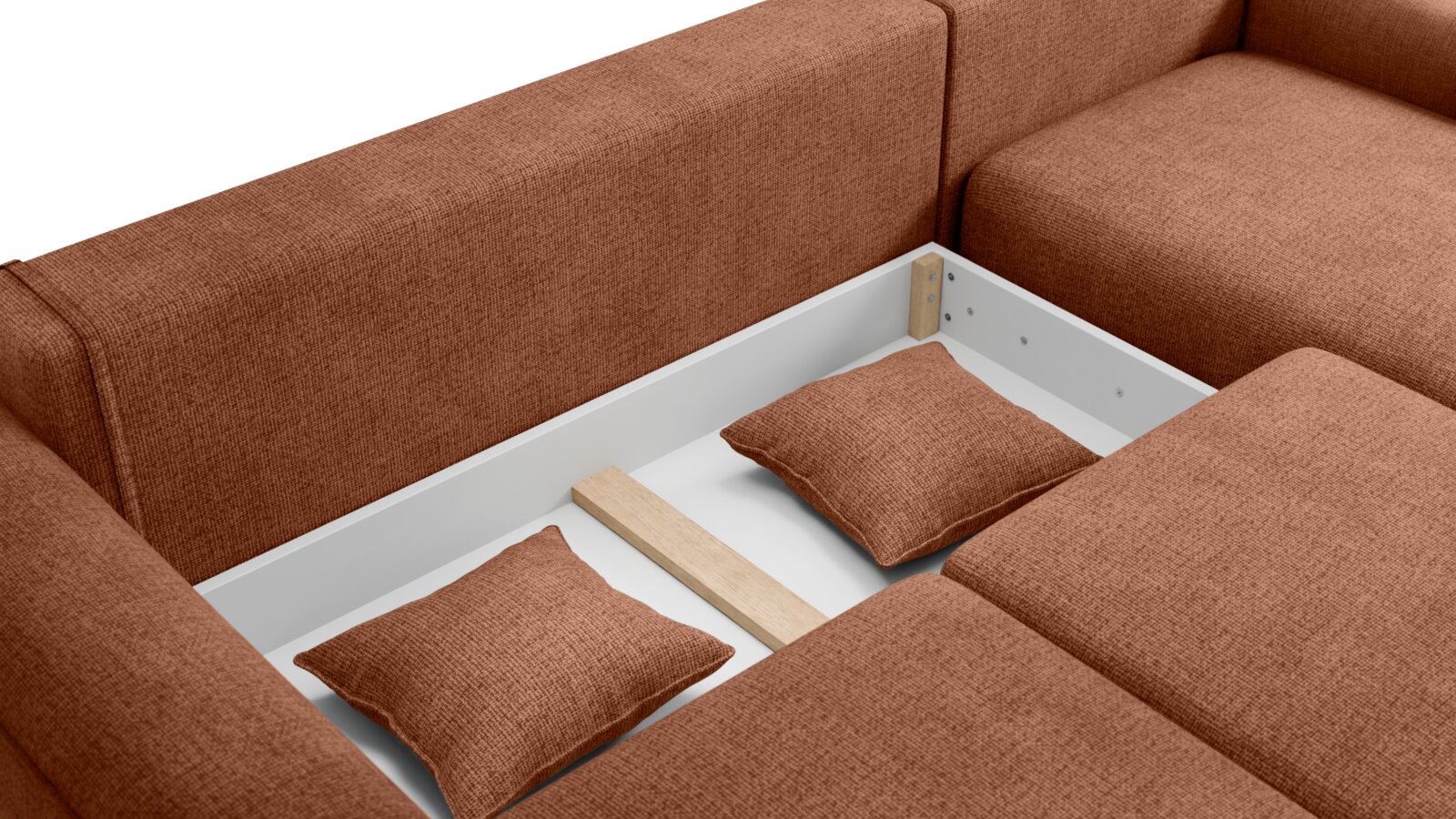 Detailansicht einer braunen Rundecke mit Stauraum und zwei Kissen, von oben betrachtet.