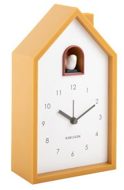 Moderner Wecker in Form eines gelben Hauses mit Kuckucksvogel, seitliche Perspektive