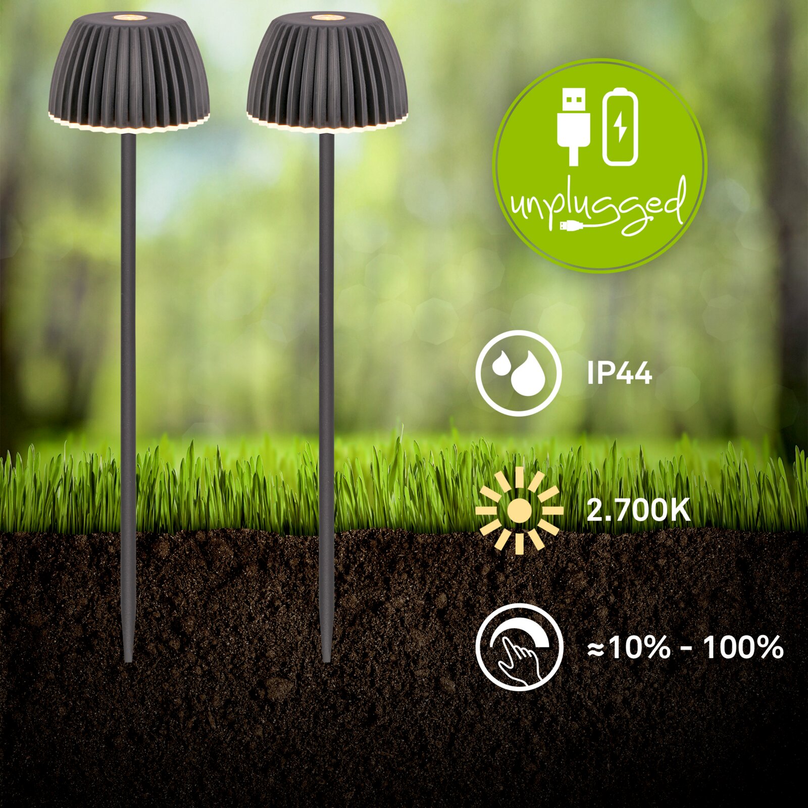 Zwei schwarze LED-Garten-Steckleuchten mit geriffeltem Schirm und warmweißem Licht (2700K), IP44, dimmbar ca. 10–100 %, USB-aufladbar (unplugged), frontale Ansicht im Boden/Gras