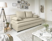 Beige functionele bank in een lichte woonkamer, zijaanzicht