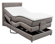 Boxspringbett mit verstellbarer Matratze und Fernbedienung, seitliche Perspektive