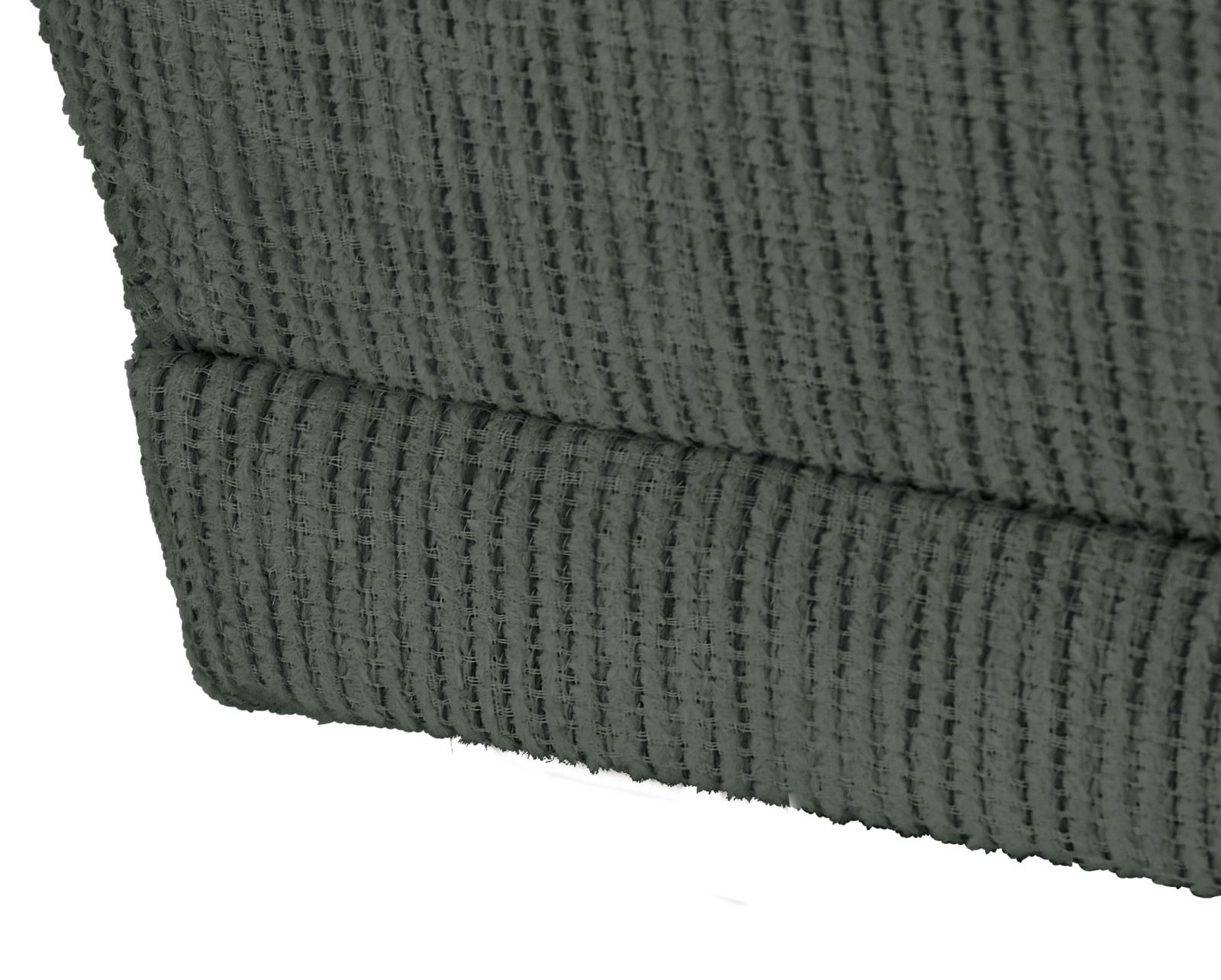 Nahaufnahme eines grauen, strukturierten Stoffes einer Recamiere, seitliche Perspektive