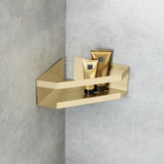 Goldene Eckablage Meleto mit zwei Tuben, an einer grauen Wand montiert, seitliche Perspektive.