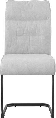 Beiger, gepolsterter Polsterstuhl mit strukturierter Stoffoberfläche und schwarzem Metall-Schwinggestell, frontal aus der Vorderansicht freigestellt auf weißem Hintergrund.