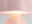 Nahaufnahme einer rosa LED Tischlampe mit sanftem Lichtschein, seitliche Perspektive.