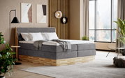 Modernes Boxspringbett in einem stilvollen Schlafzimmer, seitliche Perspektive