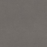 Nahaufnahme einer grauen Lederstruktur, perspektivisch von oben betrachtet.