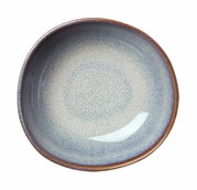 Obenansicht einer beige-blauen Müslischale mit gesprenkeltem Muster und braunem Rand.