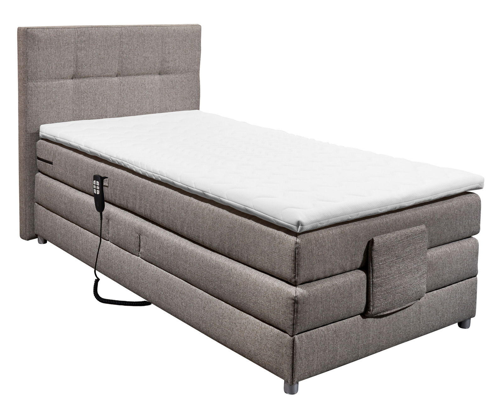 Boxspringbett in seitlicher Perspektive mit grauem Stoffbezug und Fernbedienung.