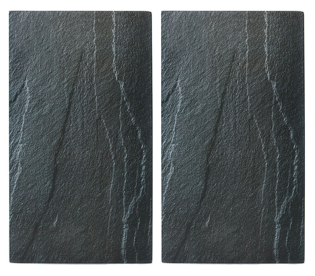 Zwei rechteckige Glasschneideplatten mit dunkler, steinähnlicher Oberfläche, von oben betrachtet.