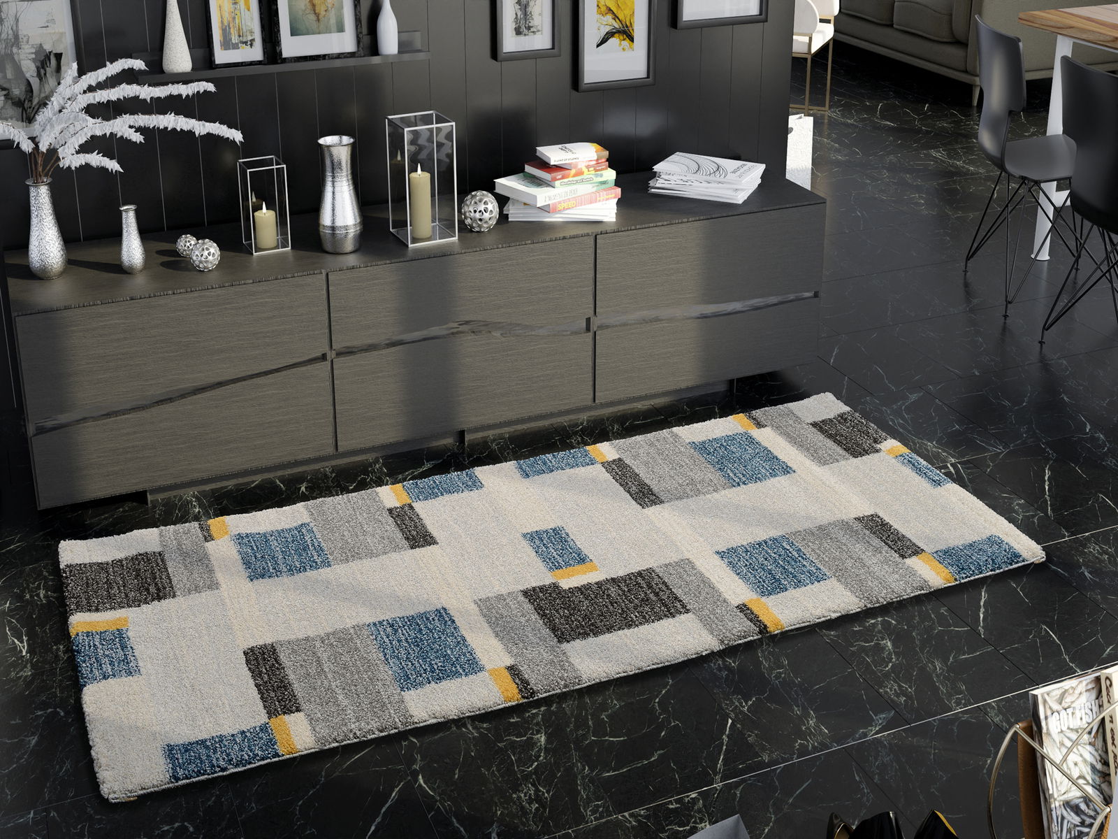 Moderner Teppich mit geometrischem Muster in Blau, Grau und Gelb auf dunklem Marmorboden, perspektivisch von oben betrachtet.