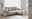 Beige Ecksofa mit Ottomane rechts, moderne Wohnzimmerumgebung, seitliche Perspektive