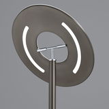 Nahaufnahme der LED-Stehleuchte MONTI mit modernem, kreisförmigem Design und leuchtenden Elementen, seitliche Perspektive.