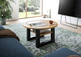 Runder Couchtisch aus Holz mit schwarzem Metallgestell, von schräg oben fotografiert, auf einem gemusterten Teppich in einem modernen Wohnzimmer.
