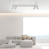 Moderne Deckenleuchte PURE-LINES von Paul Neuhaus in einem stilvollen Wohnzimmer, seitliche Perspektive.