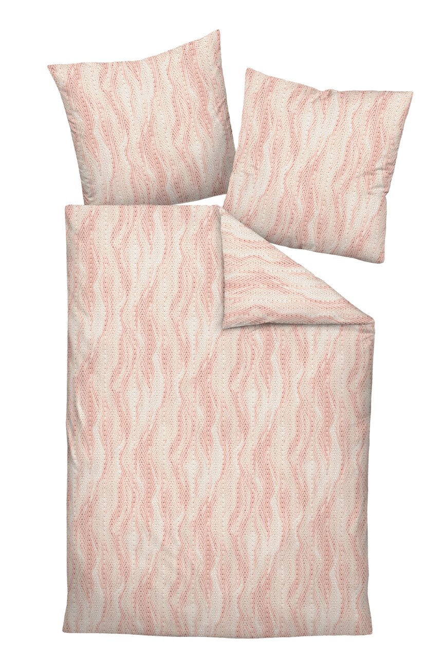 Bettwäsche-Set mit zwei Kissen und einer Decke in einem rosa-weißen, wellenförmigen Muster, von oben betrachtet.