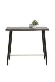 Moderner Bartisch mit dunkler Holzplatte und schwarzen Metallbeinen, frontal fotografiert. Dekoriert mit einer kleinen Pflanze und einem Glasgefäß.