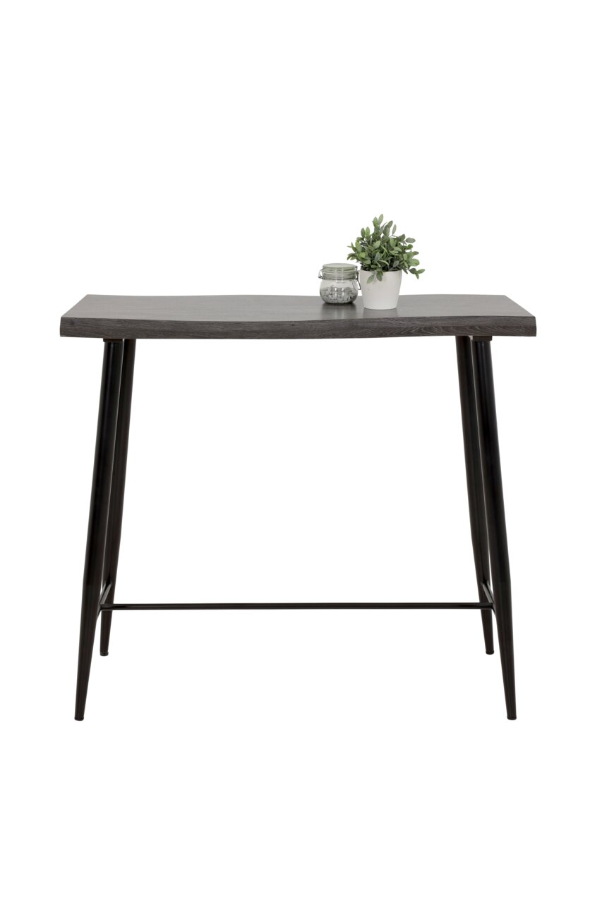 Moderner Bartisch mit dunkler Holzplatte und schwarzen Metallbeinen, frontal fotografiert. Dekoriert mit einer kleinen Pflanze und einem Glasgefäß.