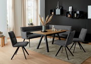 Moderner Esstisch mit Holzplatte und schwarzen Metallbeinen, umgeben von grauen Stühlen und einer Eckbank, in einem stilvoll eingerichteten Esszimmer mit Blick auf die Tischoberfläche.