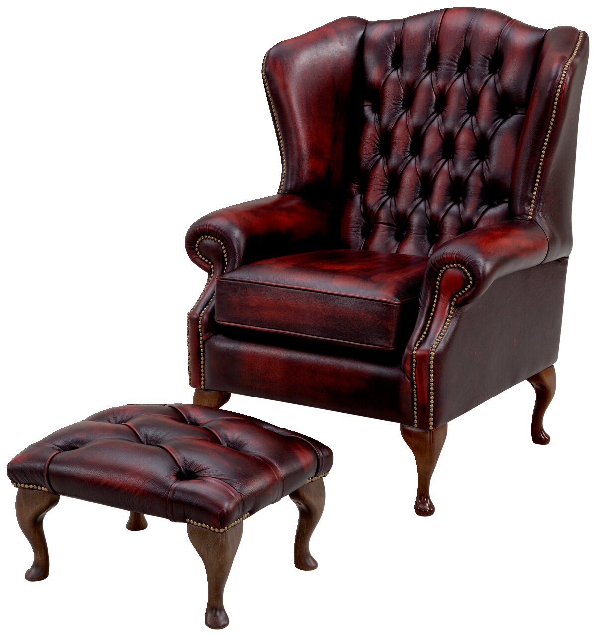 Ohrensessel aus dunkelrotem Leder mit Knopfheftung und passendem Hocker, seitliche Perspektive