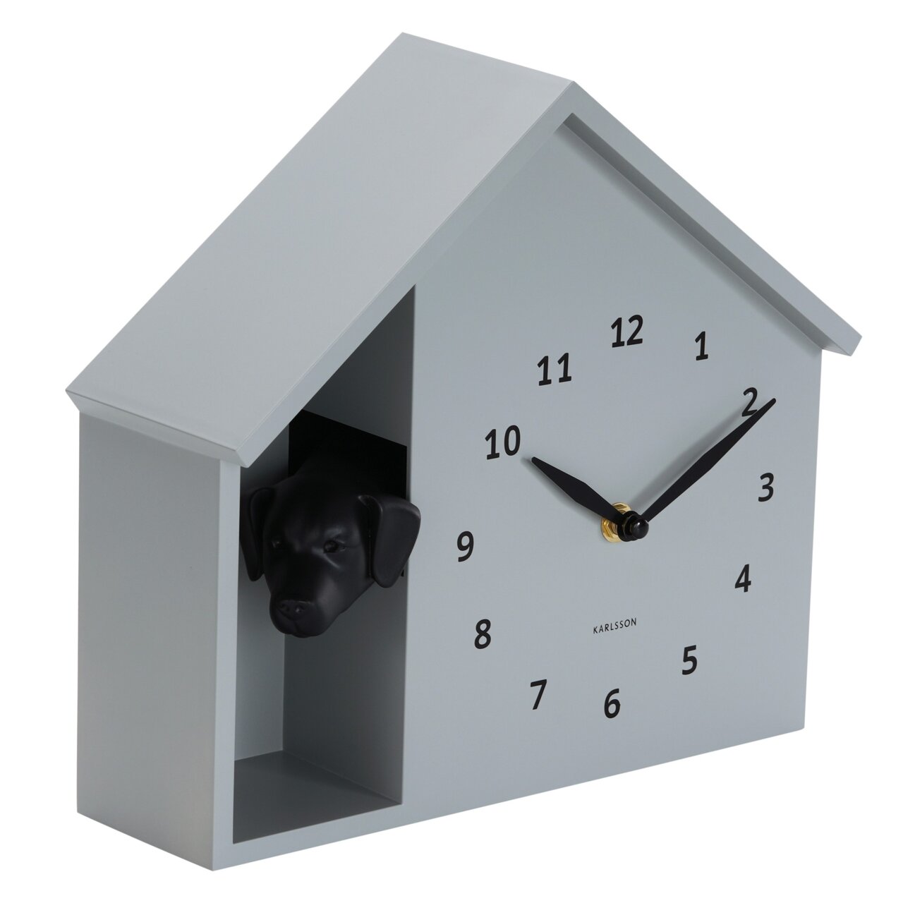 Wandklok in de vorm van een huis met een hondenkop die uit een opening aan de zijkant kijkt, zijaanzicht