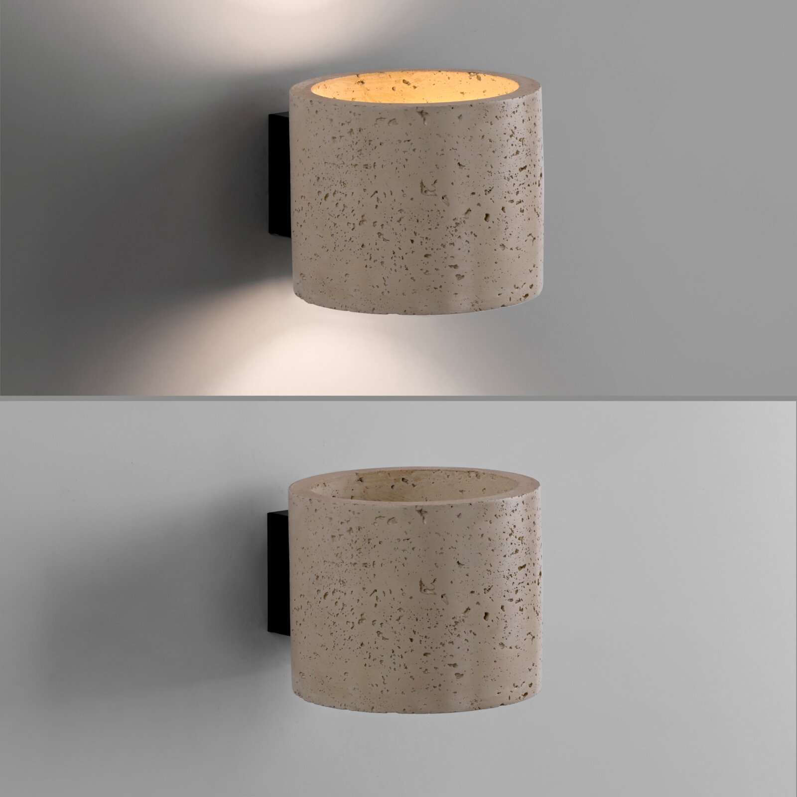 Zylindrische Wandleuchte aus hellem, porösem Naturstein/Beton mit schwarzer Wandhalterung und warmem indirektem Lichtkegel nach oben und unten, frontale Ansicht leicht von links.