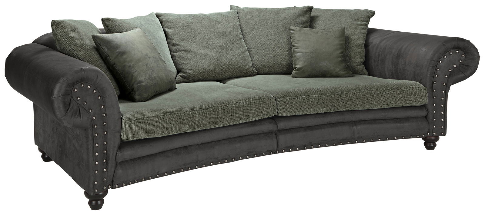 Großes, rundes Megasofa mit grünen Kissen und dunklen Armlehnen, seitliche Perspektive