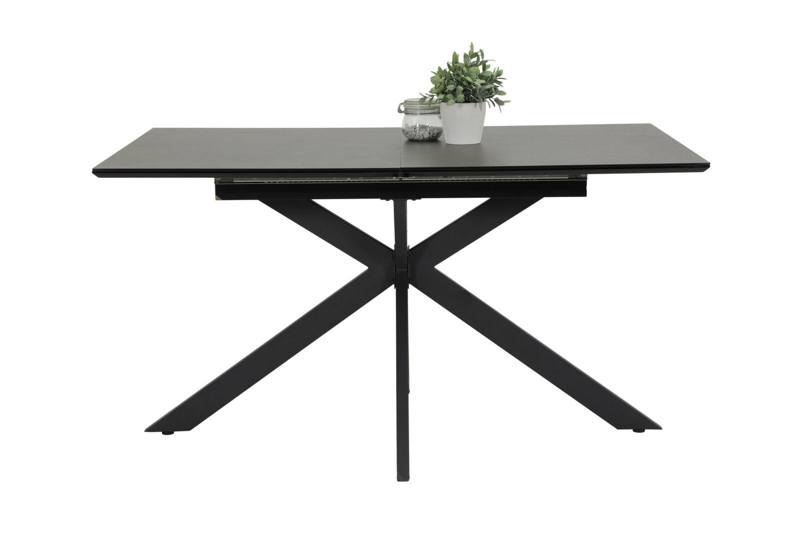 Z2 Funktions-Esstisch FENJA Moderner Esstisch mit schwarzer Tischplatte und X-förmigem Metallgestell, frontal fotografiert, mit Dekoration.