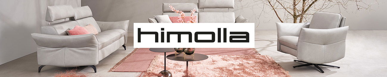 ein Wohnzimmer in hellen rosa, grau und weiß Tönen mit einer hellen Sitzgarnitur.