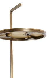 Nahaufnahme eines goldfarbenen Beistelltisches von unten, mit sichtbarer Metallstruktur und Schrauben.