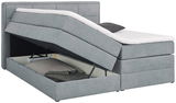Graues Boxspringbett mit geöffnetem Bettkasten, seitliche Perspektive