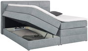 Graues Boxspringbett mit geöffnetem Bettkasten, seitliche Perspektive