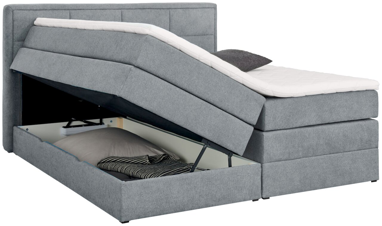 Graues Boxspringbett mit geöffnetem Bettkasten, seitliche Perspektive