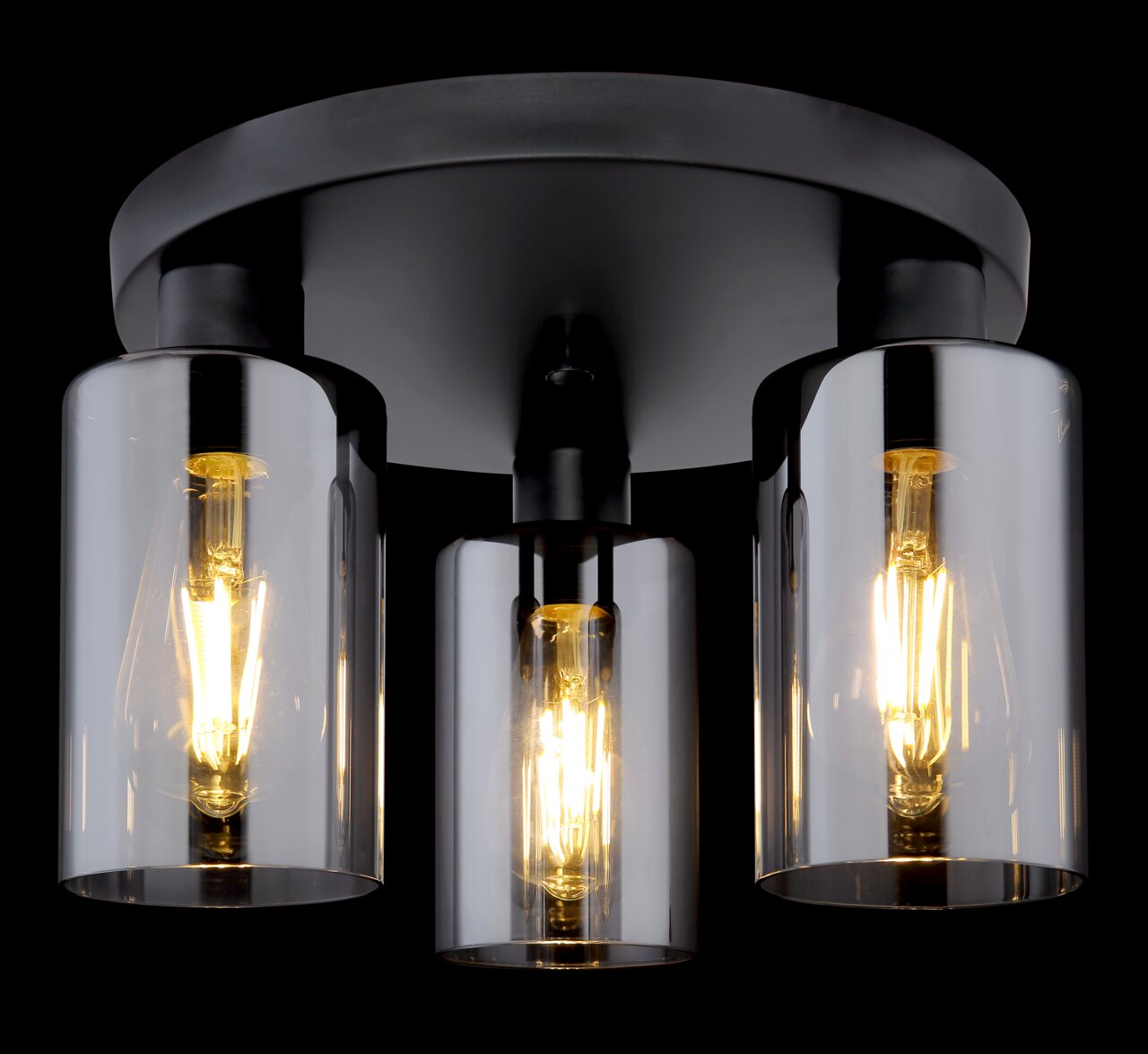 Moderne Deckenleuchte mit drei zylindrischen Glaskörpern, warmes Licht abstrahlend, von unten betrachtet.