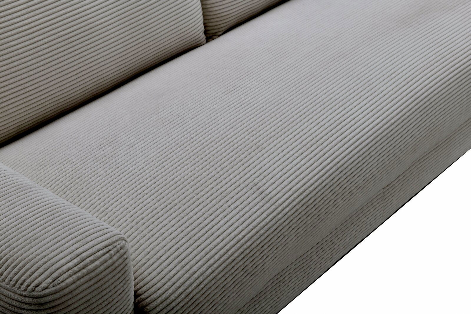 Nahaufnahme eines Funktionssofas mit geripptem Stoffbezug in Beige, seitliche Perspektive