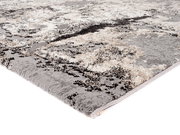 Designer Teppich in Grau- und Beigetönen mit abstraktem Muster, seitliche Perspektive