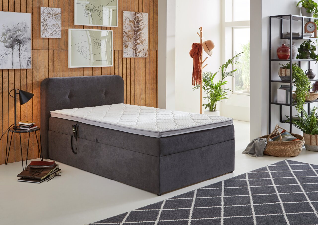 Boxbett der Serie ATHEN mit Motor in einem modernen Schlafzimmer, seitliche Perspektive