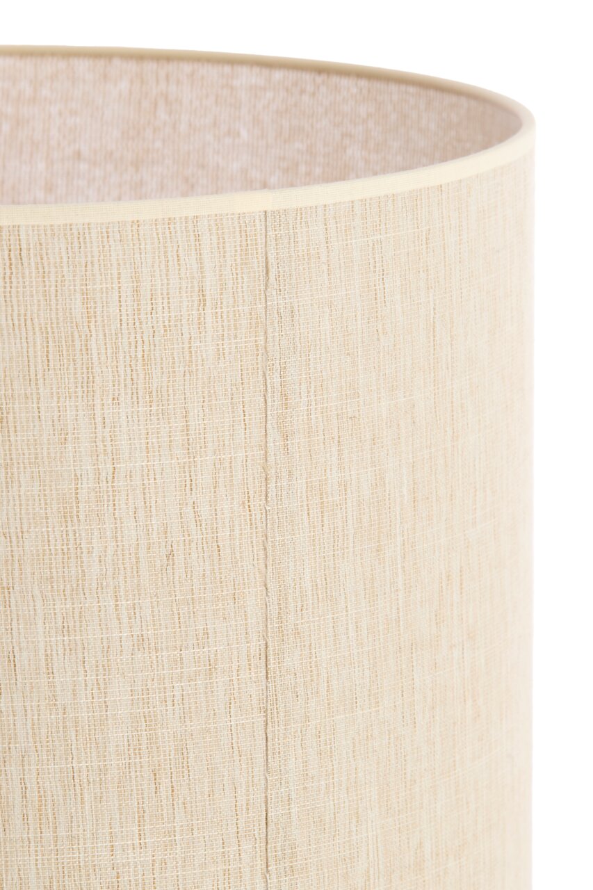 Nahaufnahme eines zylindrischen, beigen Lampenschirms mit texturierter Oberfläche.