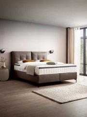 Modernes Boxspringbett in einem stilvollen Schlafzimmer, seitliche Perspektive