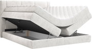 Lichtgrijs gestoffeerd boxspringbed met gewatteerd matras en opklapbare opbergruimte, schuin van voren in driekwart zijaanzicht weergegeven met geopende bodem.