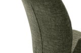 Nahaufnahme der Rückenlehne eines Sessels aus grünem Stoff, seitliche Perspektive