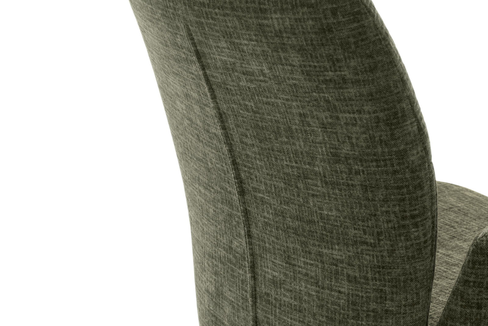 Nahaufnahme der Rückenlehne eines Sessels aus grünem Stoff, seitliche Perspektive