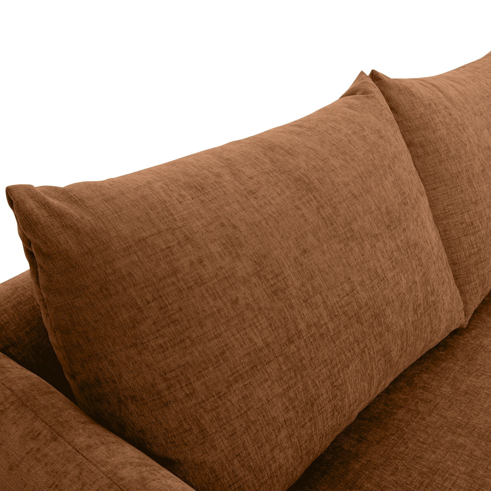 Nahaufnahme einer braunen Sofaecke mit weichen Kissen, Perspektive von oben.