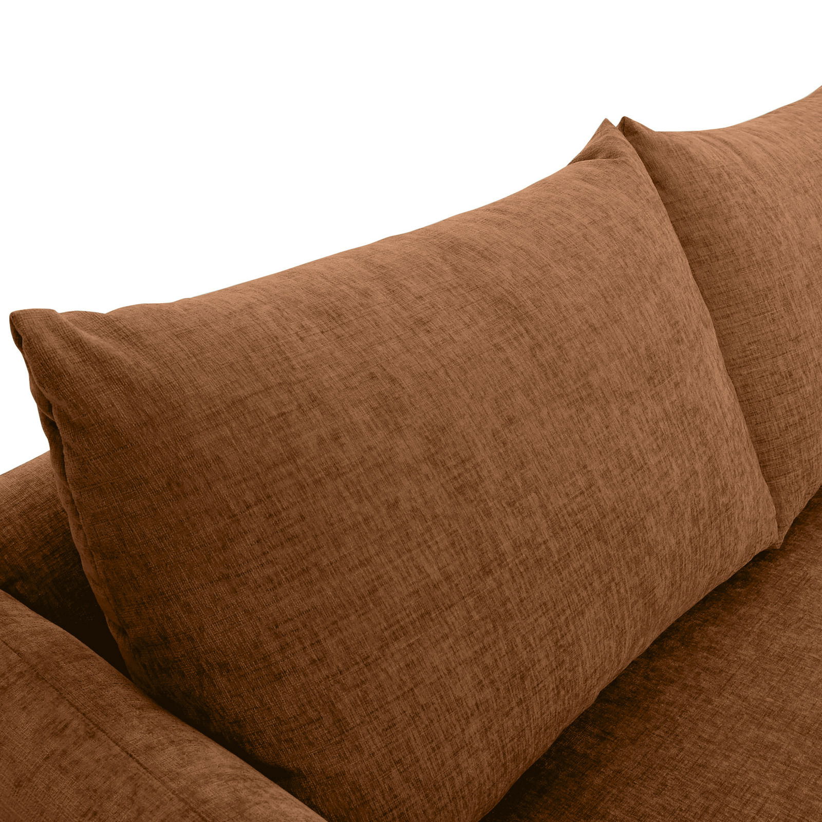 Nahaufnahme einer braunen Sofaecke mit weichen Kissen, Perspektive von oben.