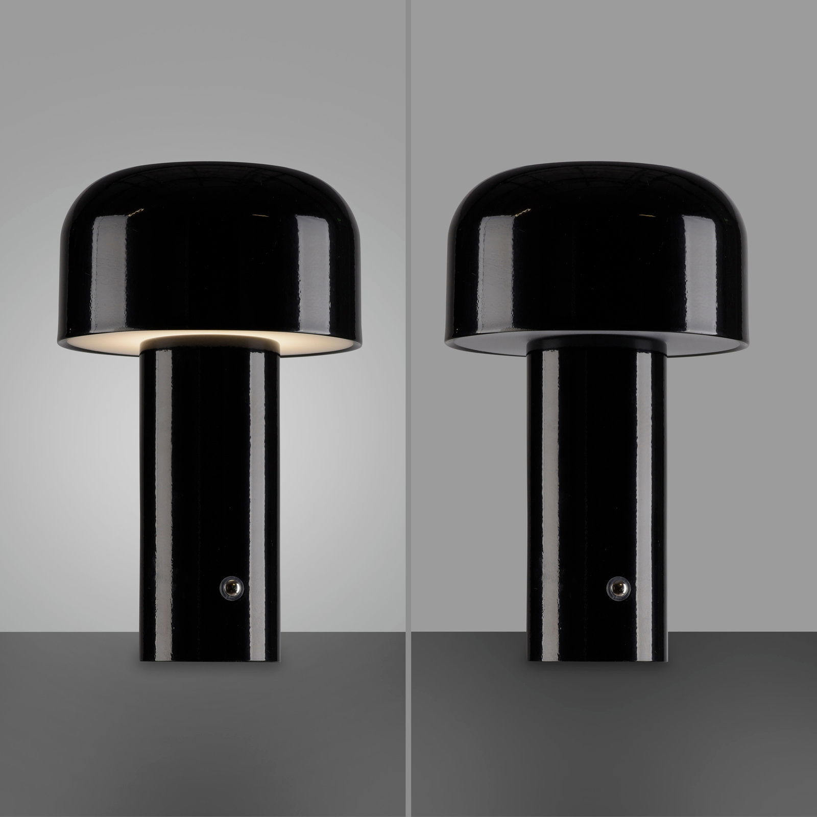 Schwarze Akku-Tischleuchte AGNES, zylindrische Form, Vorderansicht, eine Seite beleuchtet, andere Seite ausgeschaltet.