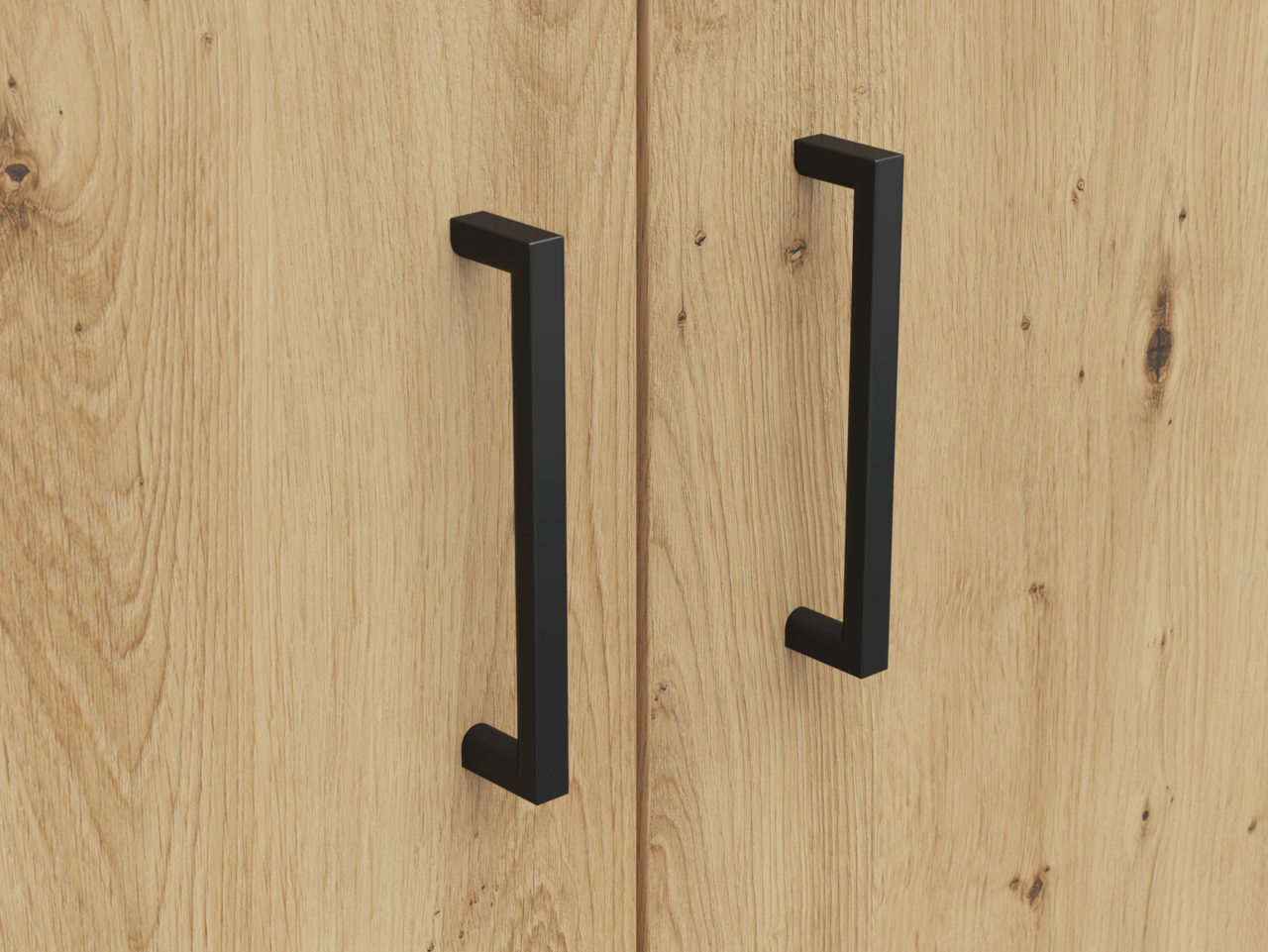 Nahaufnahme von zwei schwarzen Griffen auf einer Holzoberfläche, perspektivisch von vorne betrachtet.