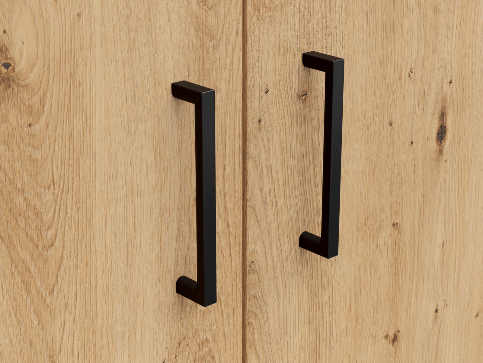 Carryhome Kommode MULTISTAURAUM Nahaufnahme von zwei schwarzen Griffen auf einer Holzoberfläche, perspektivisch von vorne betrachtet.