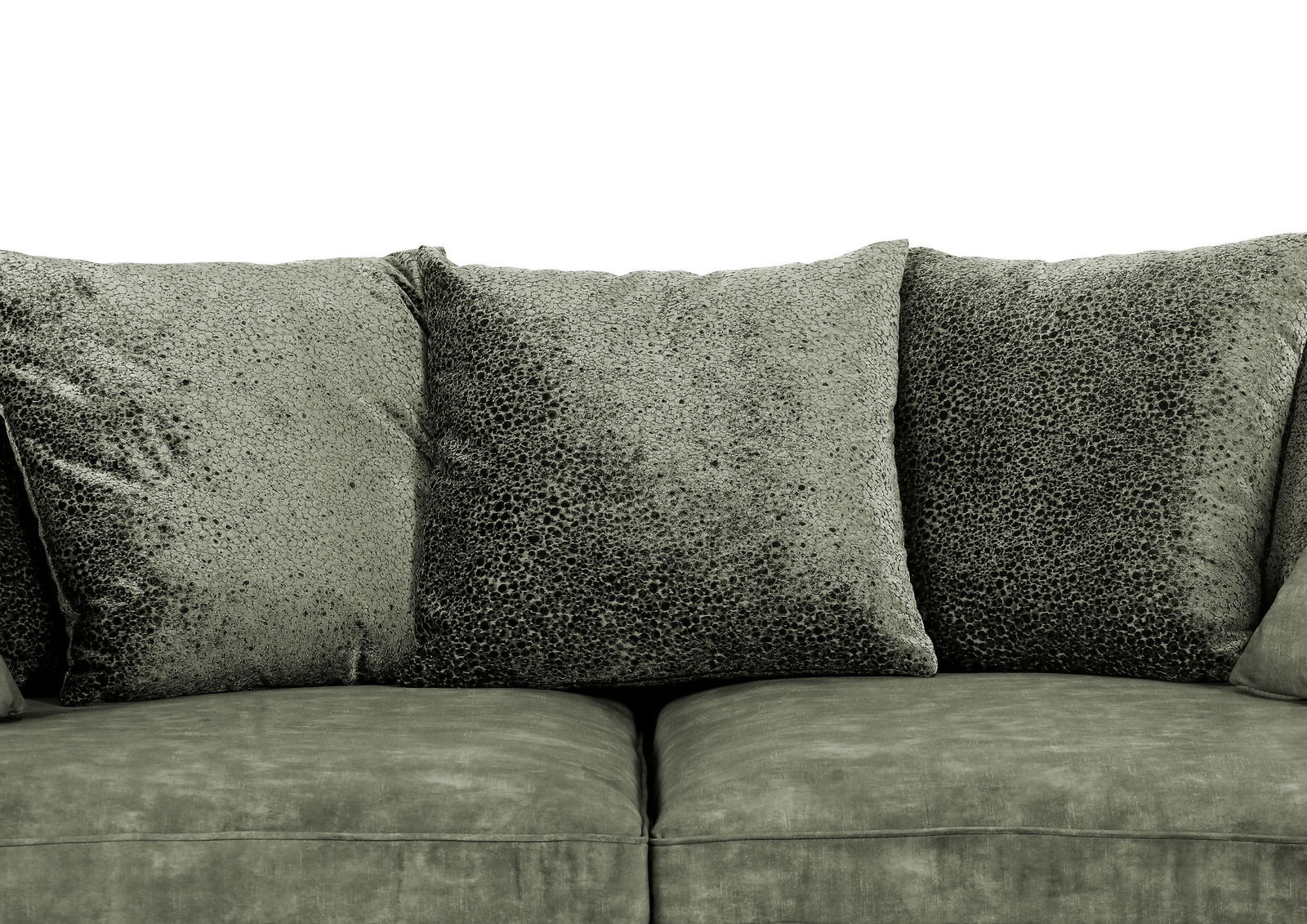 Nahaufnahme eines grünen Megasofas mit weichen, strukturierten Kissen.